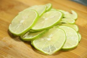 slices of lime on wooden cutboard