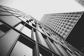 black and white lower angle of a skyscraper