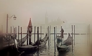 black and white photo of a gondola on a pier