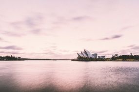 landscape of Opera House on Harbour at the pink sunset in australia, Sydney