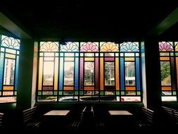 multi-colored stained-glass windows in a restaurant