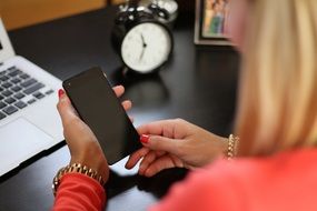 mobile phone in woman's hands