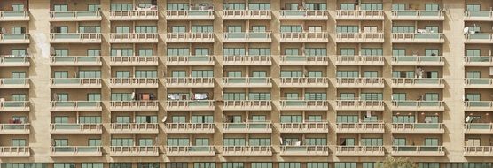 facade of urban residential building with balconies