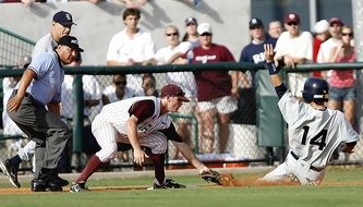 baseball player slides to the plate