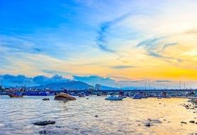 boats near the coast at blue dawn