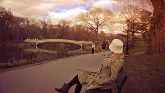 picture of woman is sitting in the park