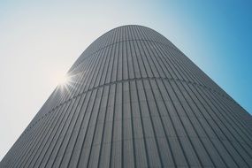 sun rays on the facade of a modern skyscraper