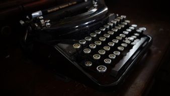 dark retro typewriter with round keys