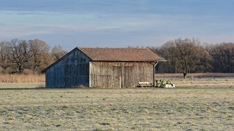 wooden shed on the field