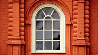 arched Window in red brick wall