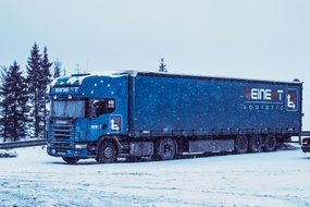 truck on a snowy road in a forest in Russia