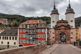 historic towers at the end of a stone bridge in Europe