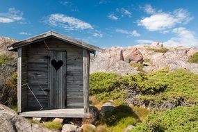 wooden rural toilet on the street