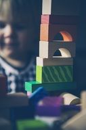 Child Plays with colorful toys