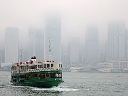 ferry boat in victoria harbor in heavy fog