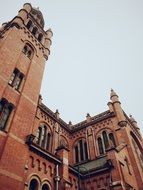 aged red brick Cathedral Building at sky