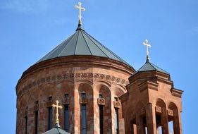 crosses on the armenian church against the blue sky