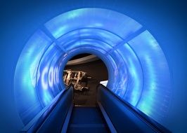 escalator in the blue tunnel