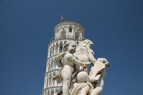 sculpture in front of the Leaning tower