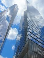 skyscrapers against the blue sky with clouds in New York