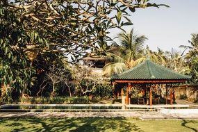 Pavilion at pond in tropical Garden