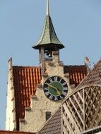 green clock tower in the city center