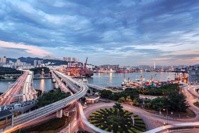 panorama of the bridges with colorful lights in the port city