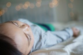 sleeping baby in bed