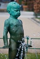 statue of a boy in a park in norway