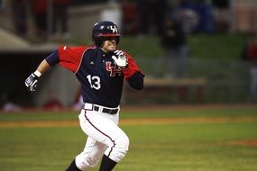 baseball player running across the field