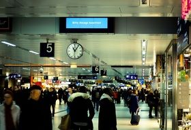 Lots of humans on a railway station