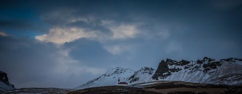 clouds over snowy mountains