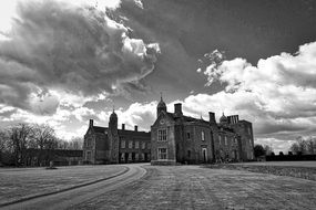 black and white photo of a medieval mansion