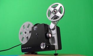 cinema projector on a green background