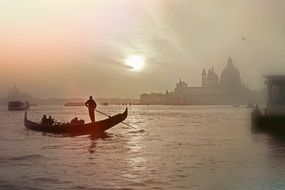 gondola on the canal in venice at sunset