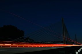 red lights on a car bridge at night