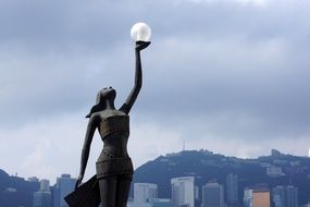 female sculpture on the background of Hong Kong