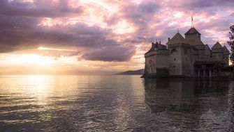 castle on a background of dark pink sunset in Switzerland