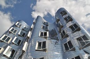 glossy modern building by gehry