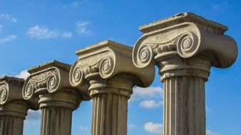 greek columns against blue sky