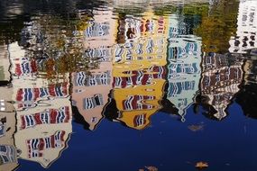 reflection of colorful houses in the water