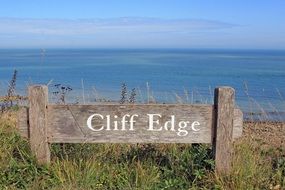 sign on the hill near the beach