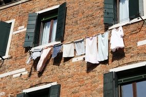 laundry on the facade of an old house