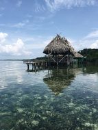 wooden bungalow on water in a ocean