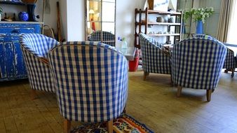 chairs with white blue upholstery in the interior of the room