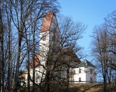 photo of a chapel among autumn trees