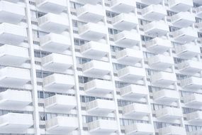 architecture of white balconies on the facade of the building