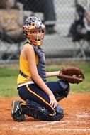 Girl softball catcher on the competition