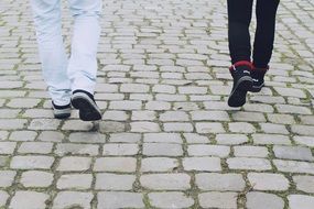 feet on the pavement while walking