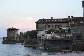 picturesque old buildings on Lake Garda at dusk, Italy